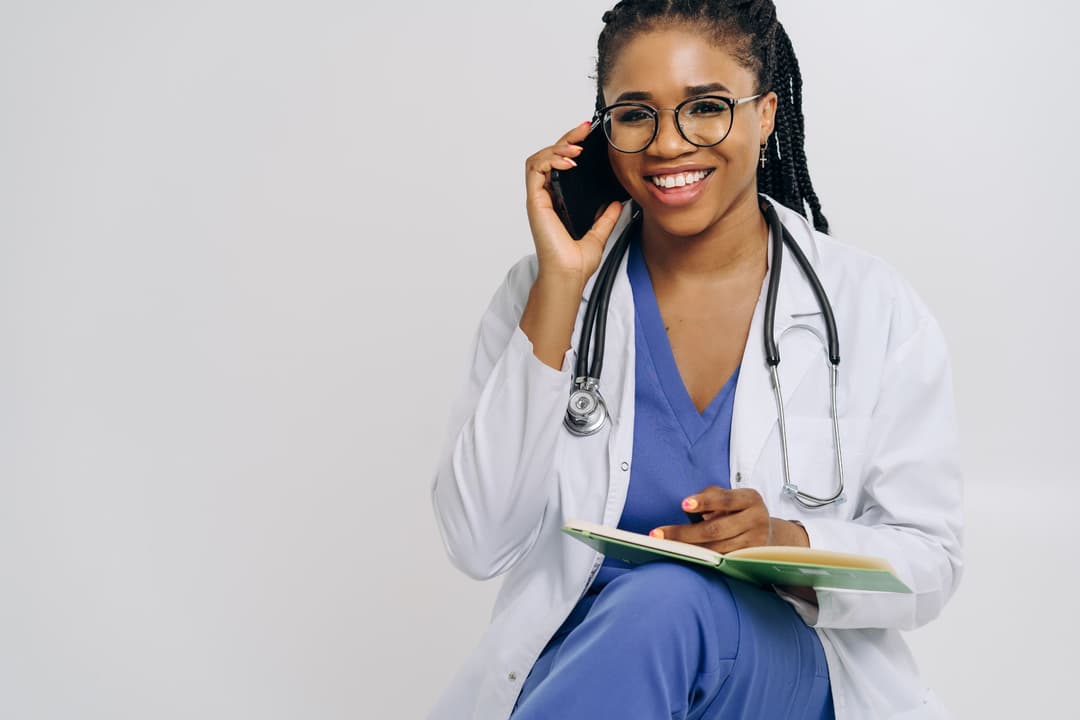 Consultant reviewing booking history while helping a customer reschedule a cancelled appointment