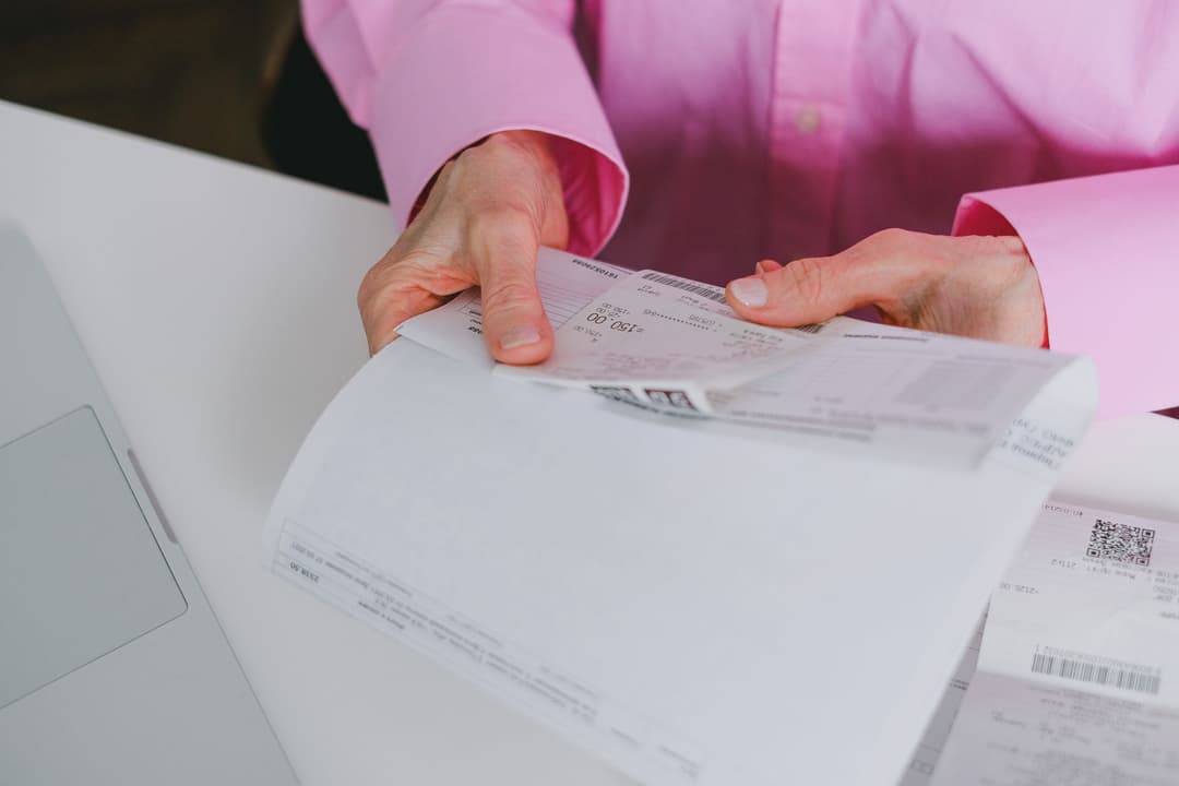Office manager recording and categorising a recurring service bill