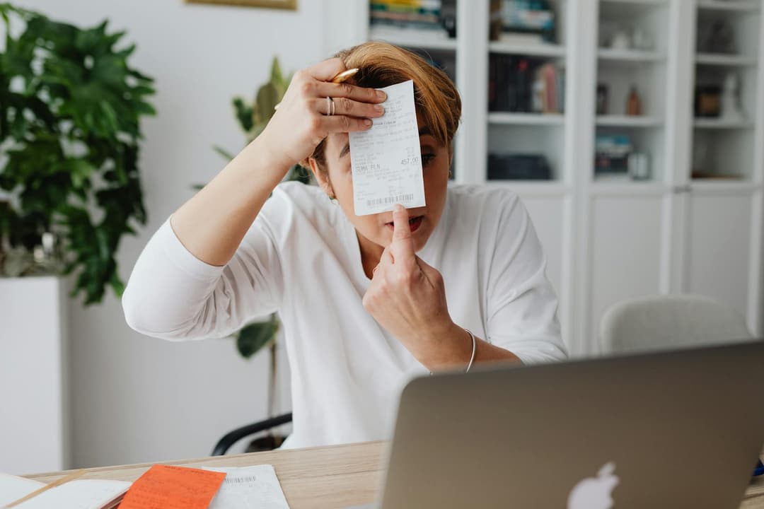 Finance admin preparing a credit note with customer invoice records on screen