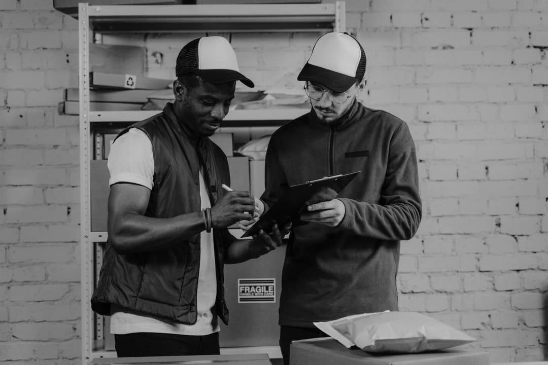 SME staff reviewing recipient and site details on a delivery document