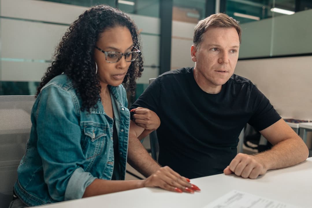 Sales and finance staff checking whether two invoice requests relate to the same delivery