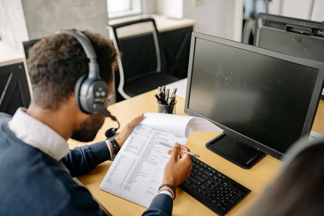 Operations coordinator checking draft and sent invoice statuses in a sales document list