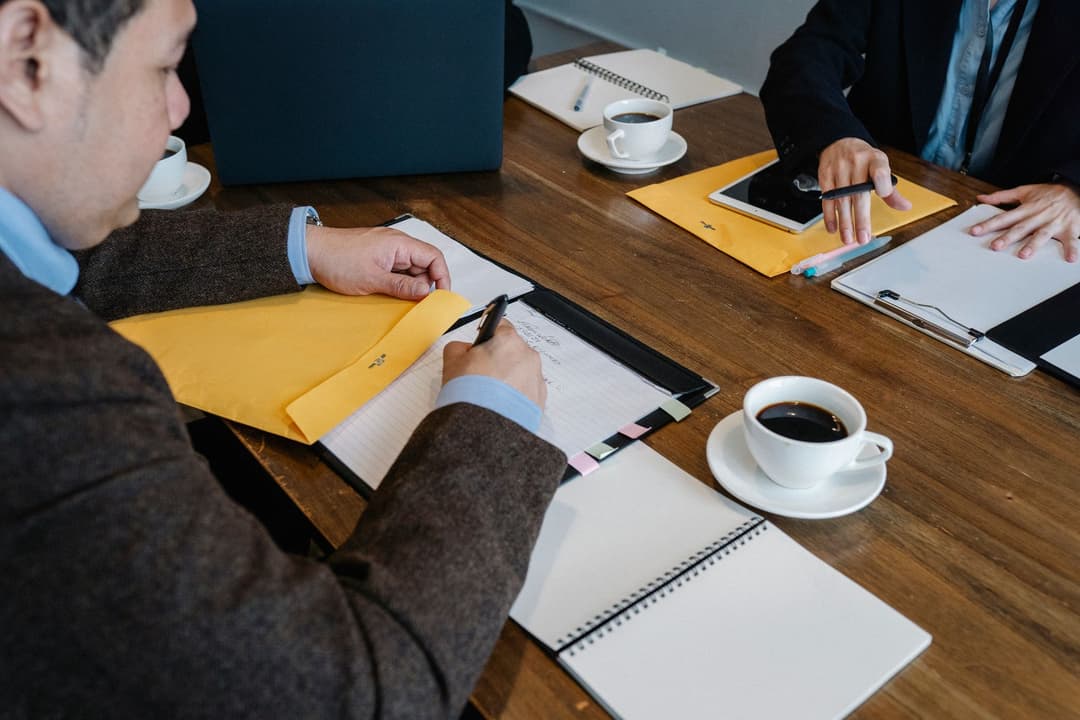 Salesperson recording a customer-meeting expense with a receipt