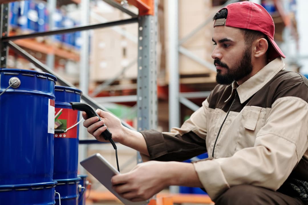 Inventory controller reviewing stock count differences before adjustment