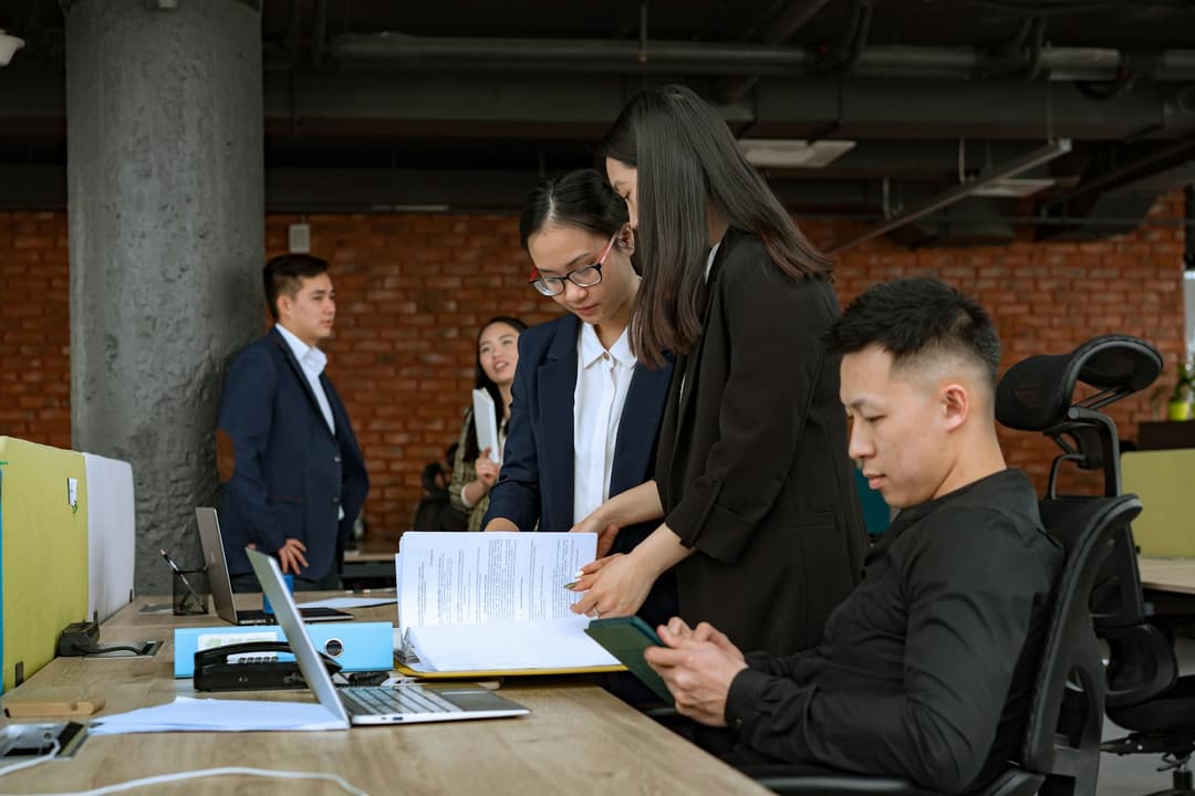 Team comparing invoice details with supporting business documents