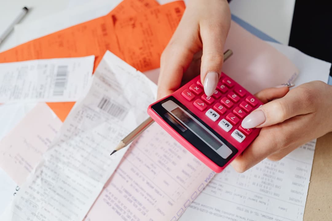 Bank transfer confirmation being checked against a customer invoice