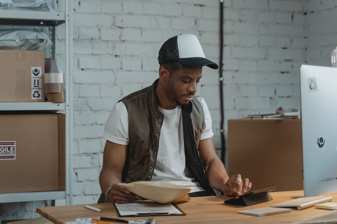 Purchasing coordinator reviewing outstanding quantities and a revised supplier delivery date