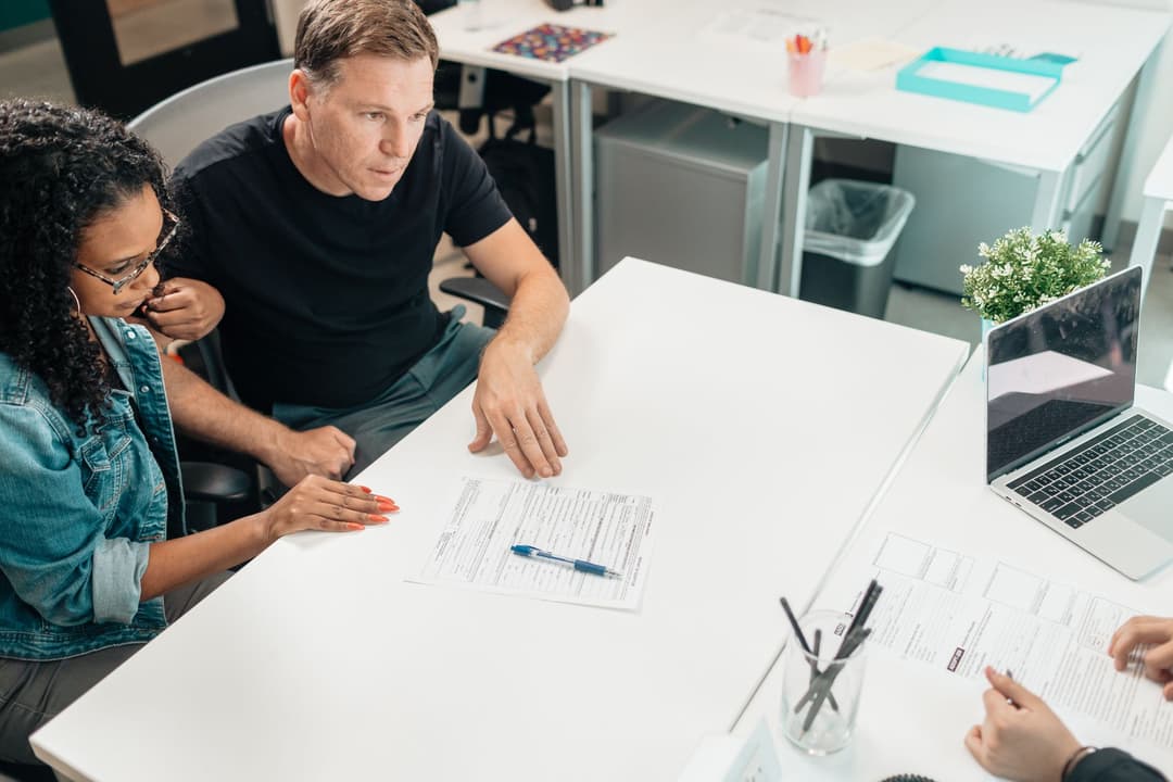 Sales operations executive explaining deposit and milestone payment expectations