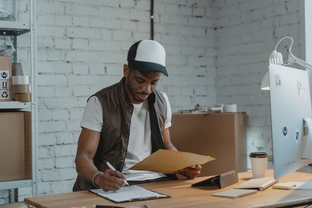 Sales coordinator comparing similar products while preparing a quotation