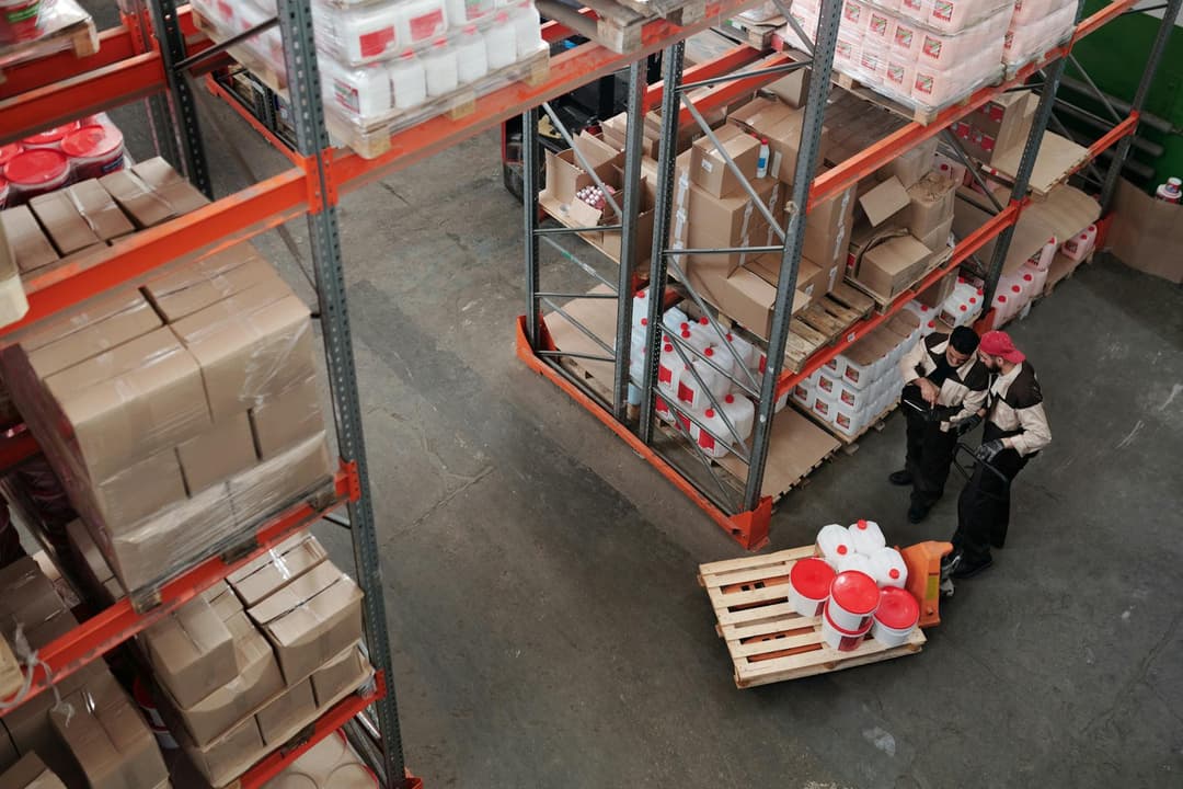 Distribution team checking catalog and price updates before preparing quotations
