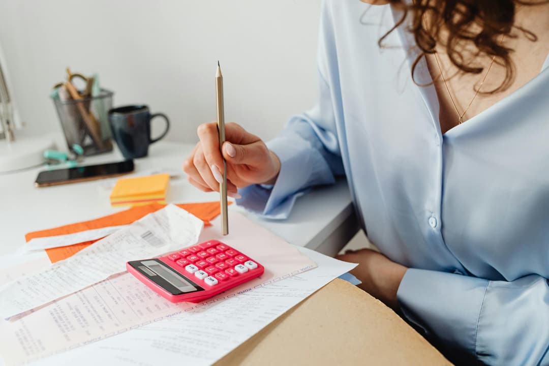 Finance admin working through invoice and payment reminders