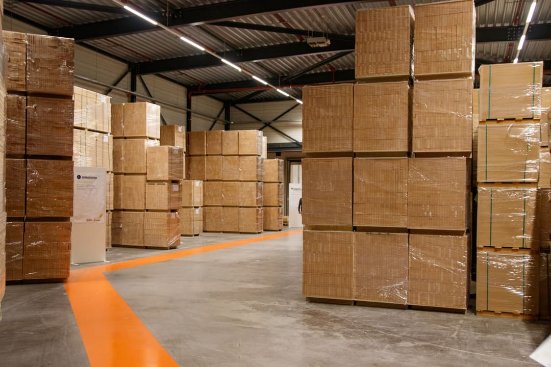 Warehouse staff preparing deliveries for stock that has already been committed