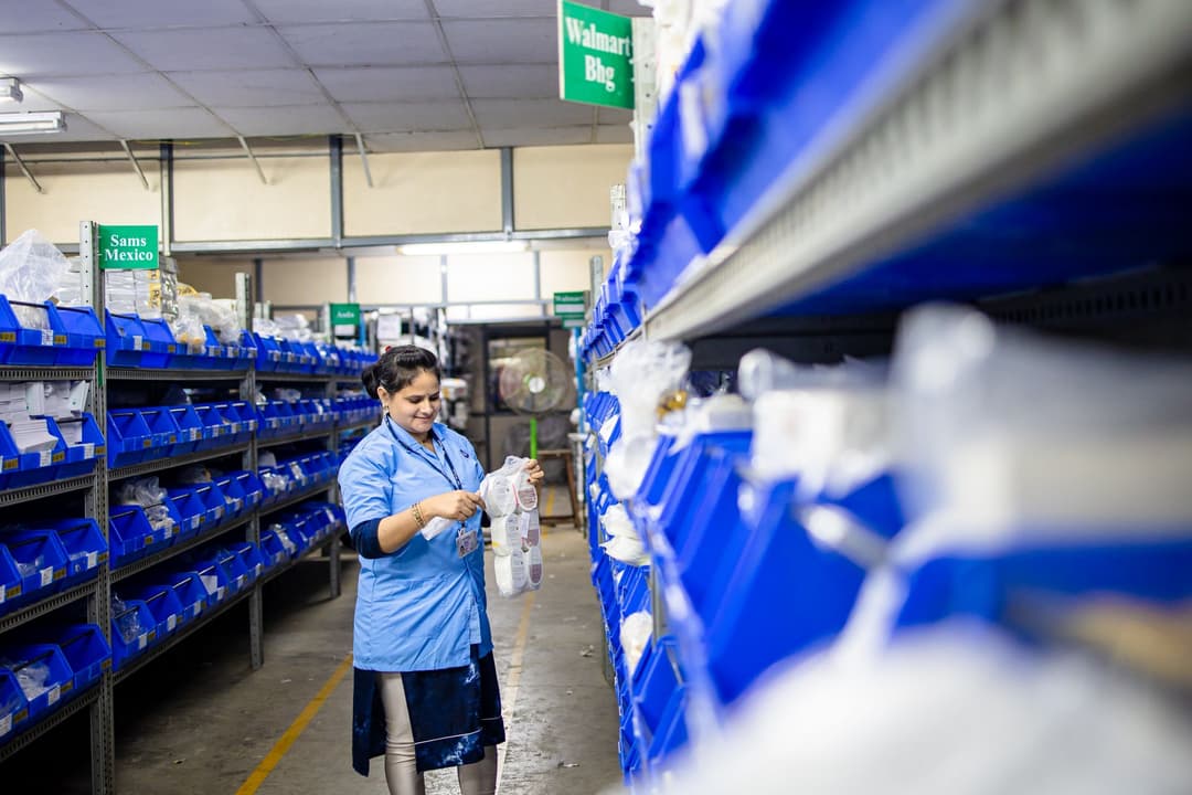 Warehouse staff preparing a picking list from a confirmed sales order