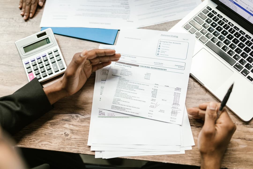 Admin manager checking spreadsheet data against business documents