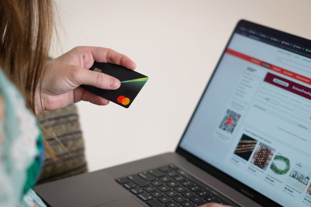 Purchasing coordinator checking a supplier credit against an invoice after a short delivery