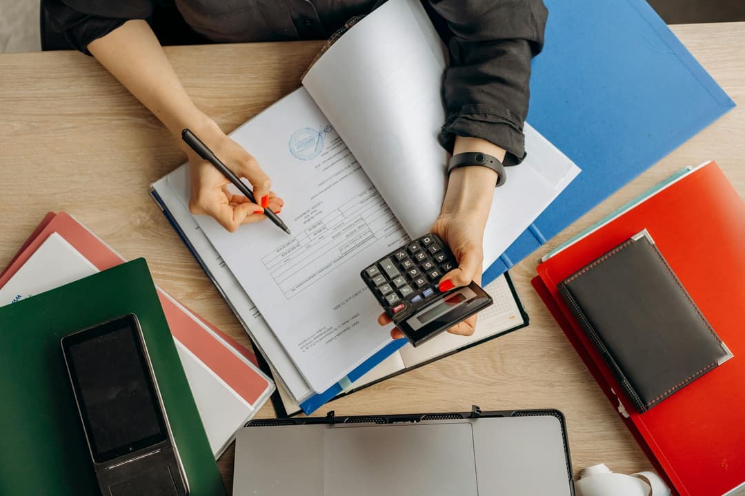 Finance admin matching a delivery order to invoice preparation records