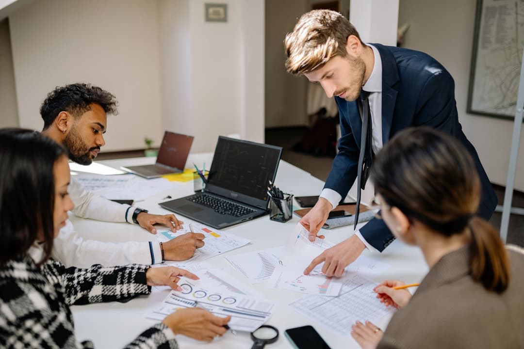Finance team matching supplier invoices with bank payment confirmations