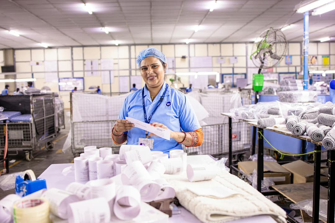 Warehouse employee recording a partial delivery of manufacturing components
