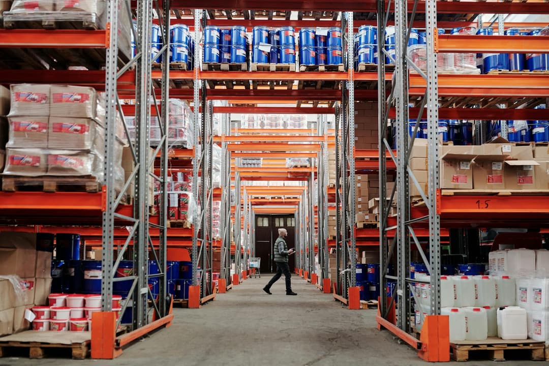 Warehouse staff verifying physical stock counts against system quantities